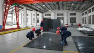 Flatpack steel storage container and compact transport components at a commercial industrial facility.